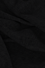 Digital linen chambray fabric, draped on floor with folds in it, charcoal black colour. 