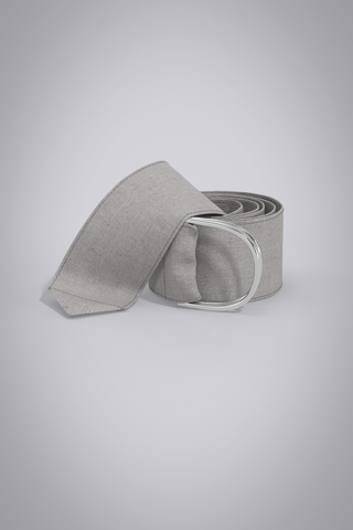 3D Linen fabric belt with silver d-ring closure, displayed coiled on grey gradient background.