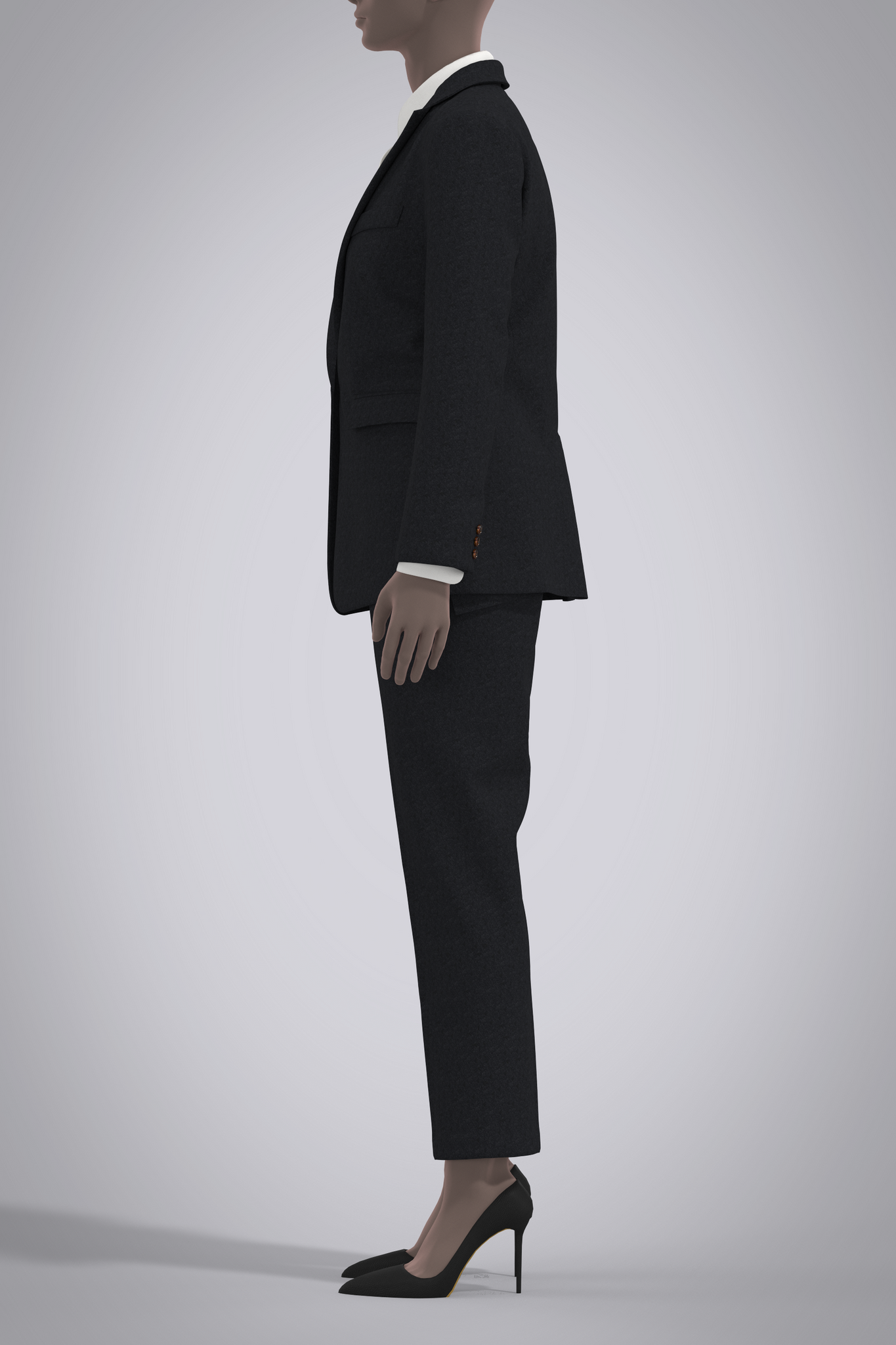 Digital black cashmere suit on female avatar with white button-down poplin shirt. Left side view with avatar's arms by her sides, wearing black pump heels, cropped at her nose..