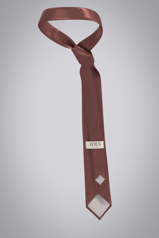 3D Neck tie as if tied on an avatar, but floating in air. Viewed from behind seeing both ends of the tie, with skinny end looped through label. Tie is dark pink, shiny silk twill fabric. 